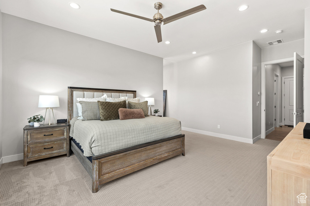 Bedroom with light colored carpet, recessed lighting, and ceiling fan