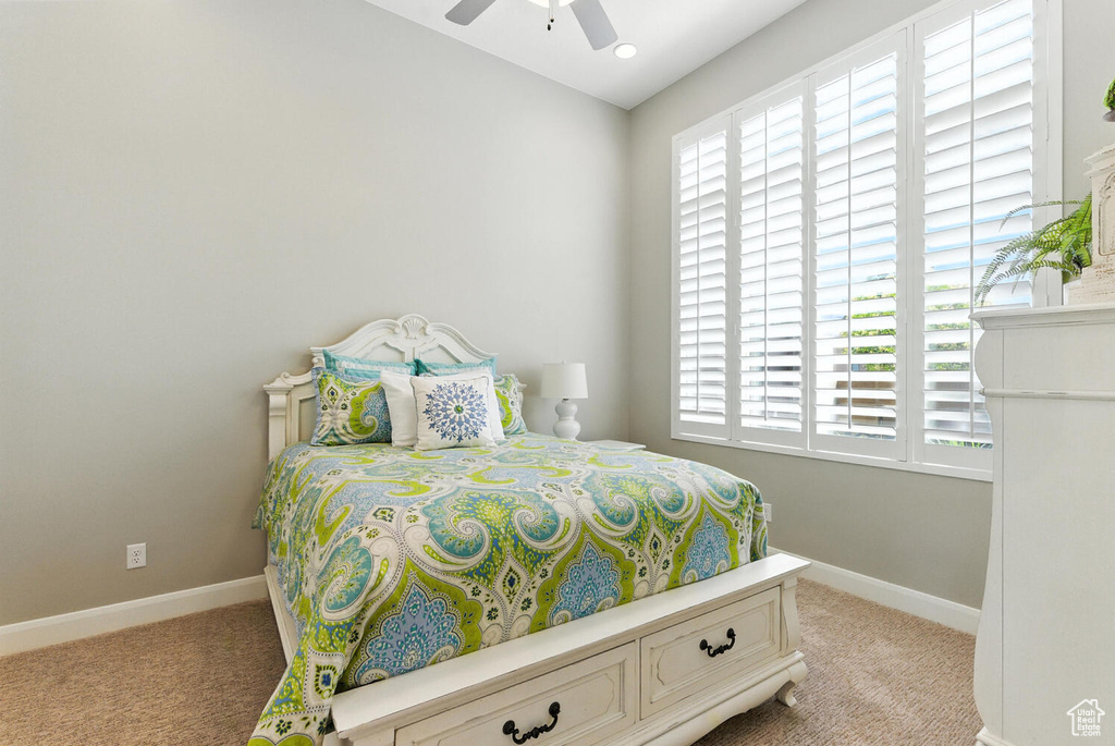 Bedroom featuring carpet and ceiling fan