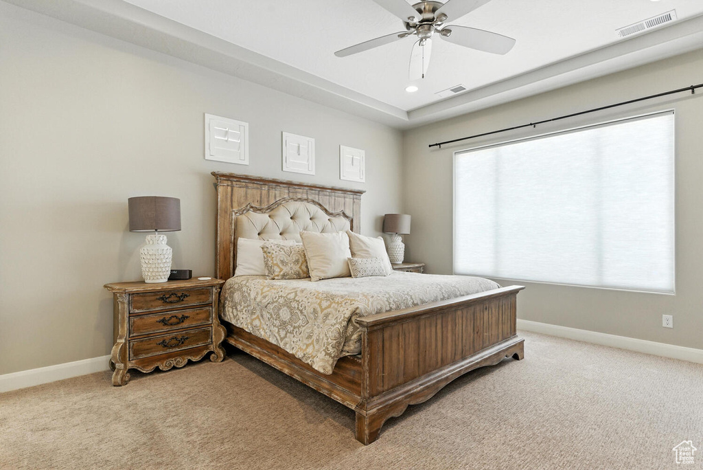 Bedroom featuring light colored carpet, recessed lighting, and a ceiling fan