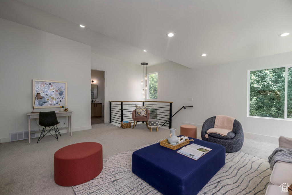 Living area featuring carpet flooring and recessed lighting