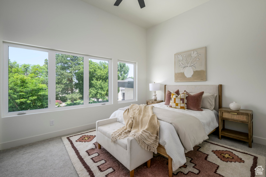 Bedroom with carpet floors and a ceiling fan