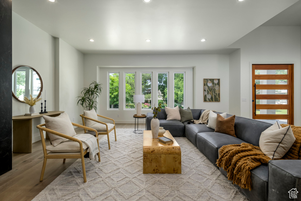 Living room featuring recessed lighting and light wood-style flooring