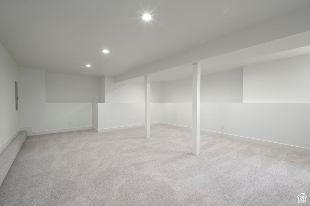 Finished basement featuring recessed lighting and light colored carpet