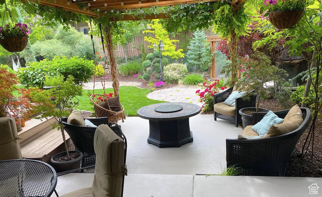 View of patio / terrace with an outdoor living space with a fire pit