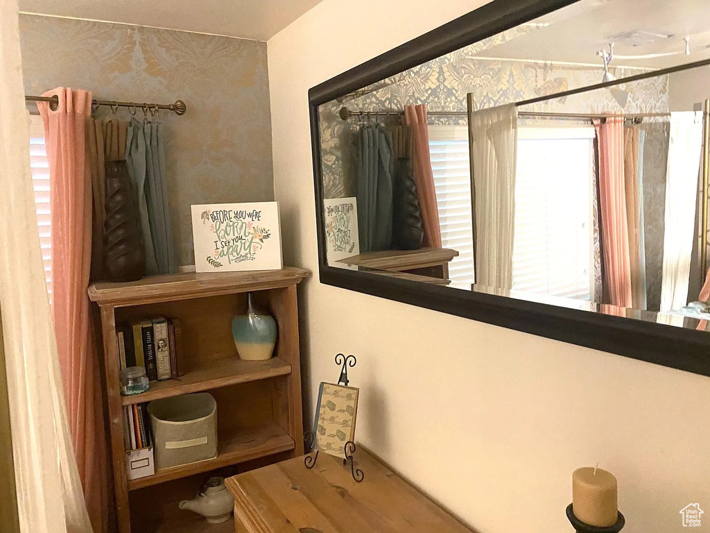 Bathroom with wallpapered walls