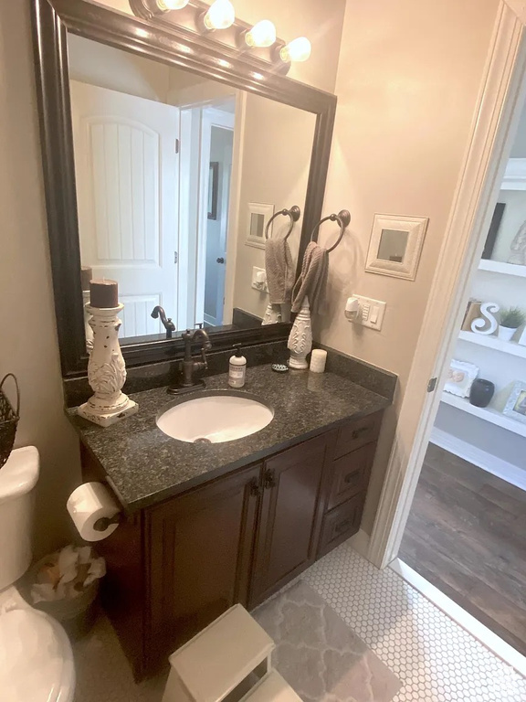Bathroom with vanity, tile patterned floors, and built in features