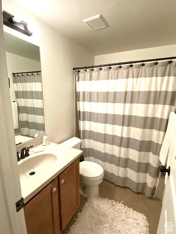 Bathroom featuring vanity and tile patterned flooring