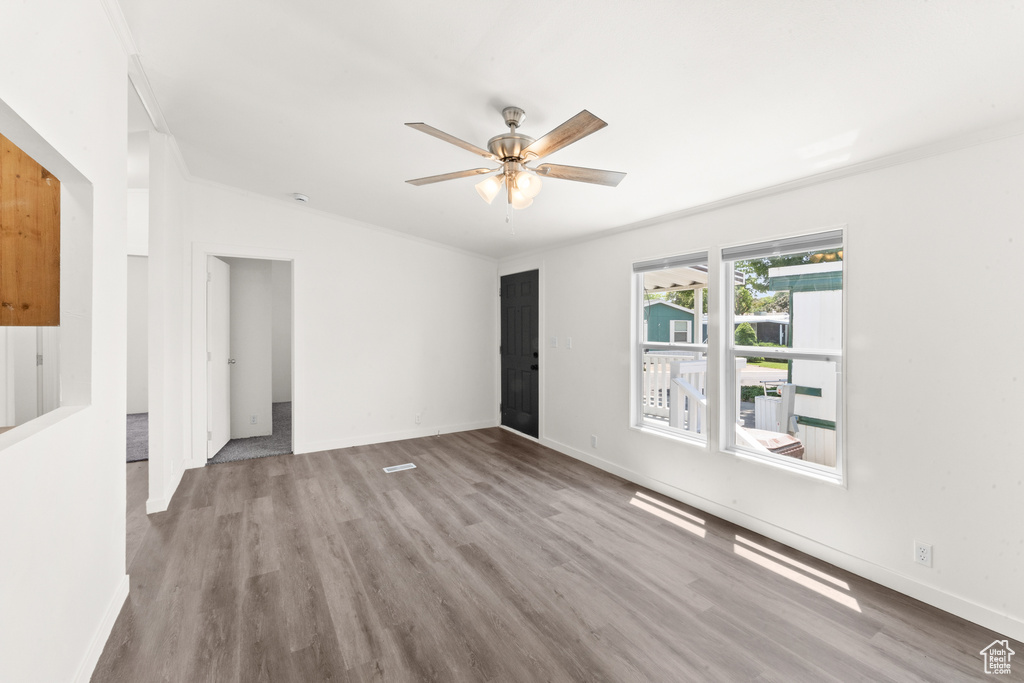 Spare room featuring a ceiling fan and wood finished floors