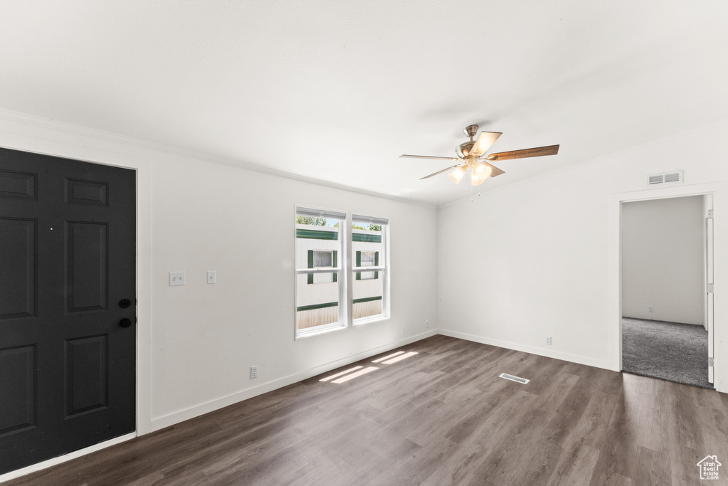 Entrance foyer featuring ceiling fan and wood finished floors