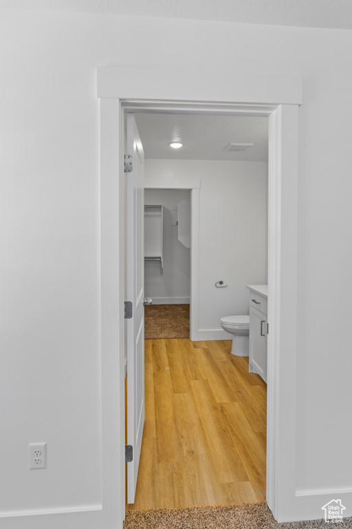 Hallway with light wood-type flooring