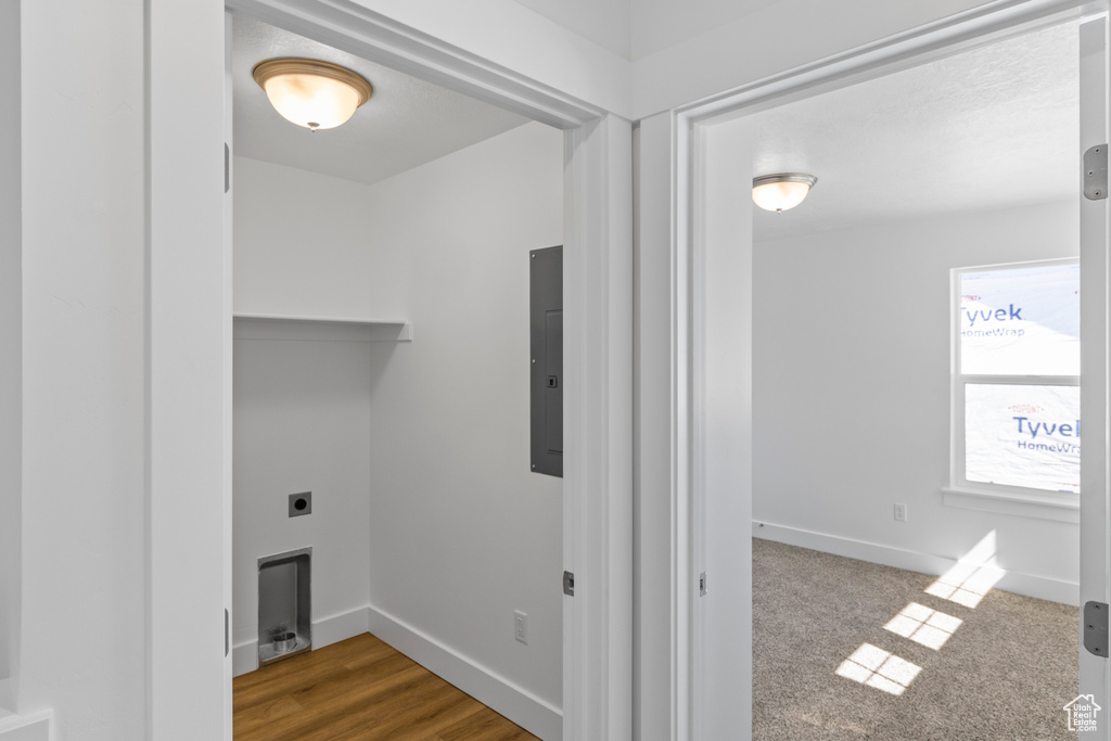 Laundry room featuring electric panel and electric dryer hookup