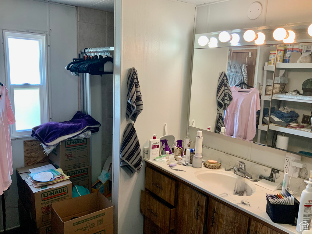 Bathroom with plenty of natural light and vanity