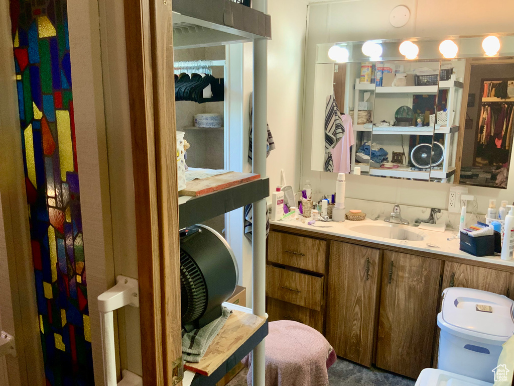 Bathroom featuring vanity and toilet