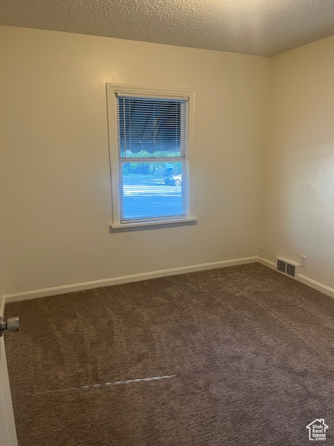 Spare room with carpet flooring and baseboards
