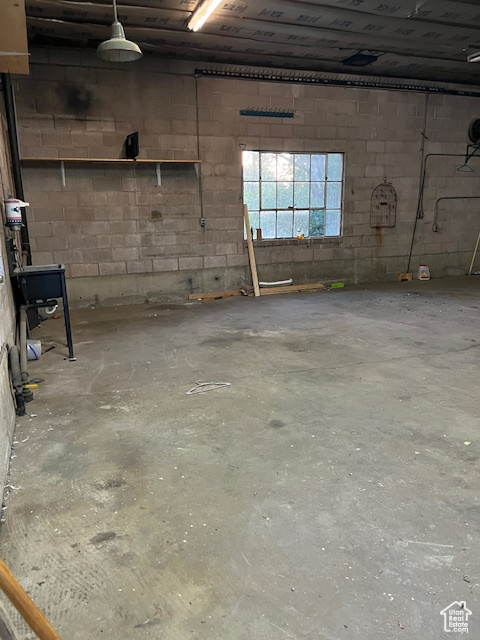Below grade area featuring concrete block wall