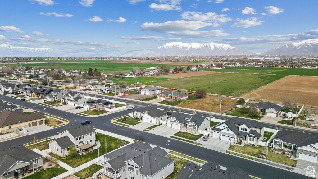 Aerial perspective of suburban area with a mountain backdrop