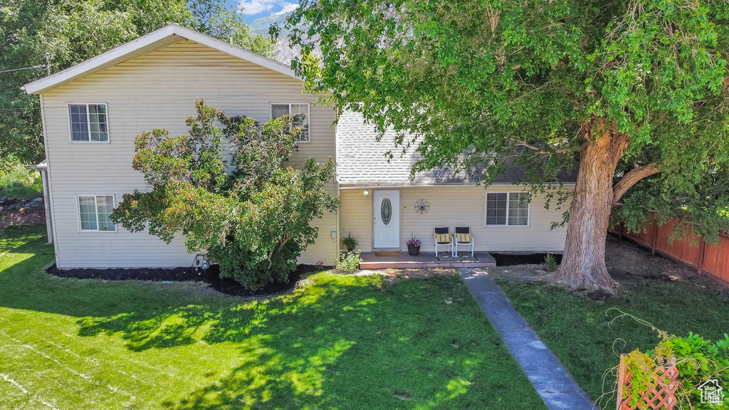 View of front of property featuring a wooden deck