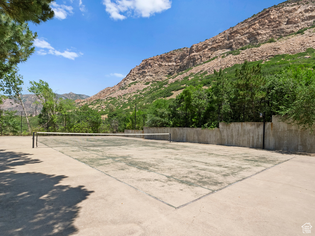 View of tennis court featuring a mountain view