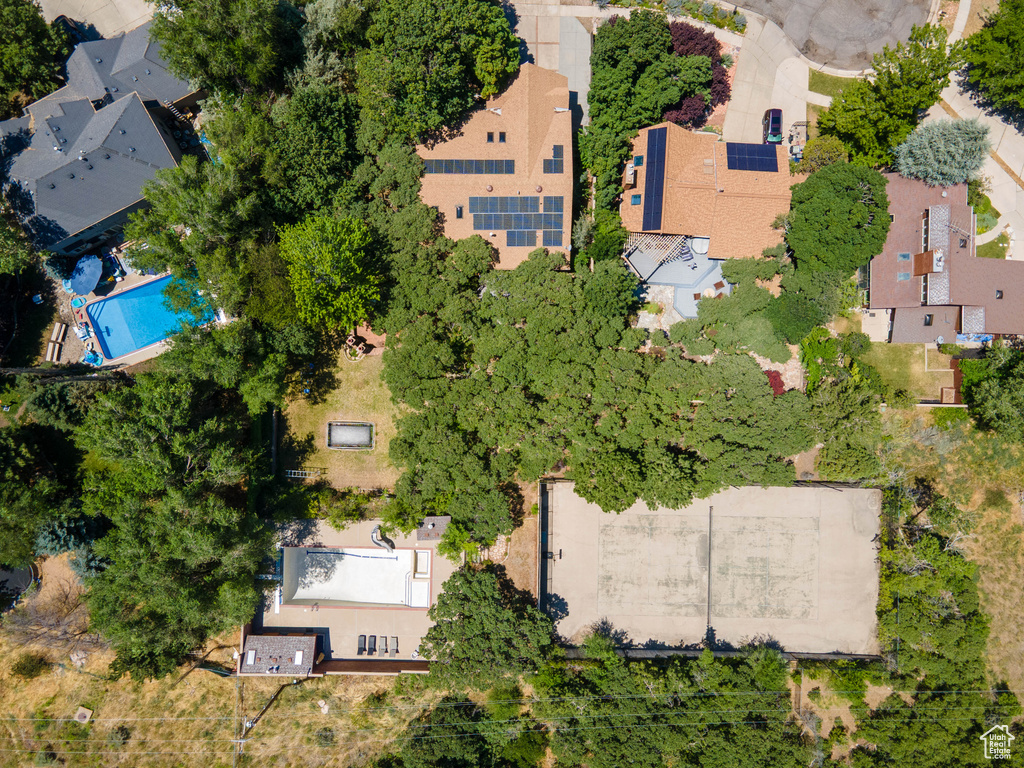 Aerial perspective of suburban area with a pool area