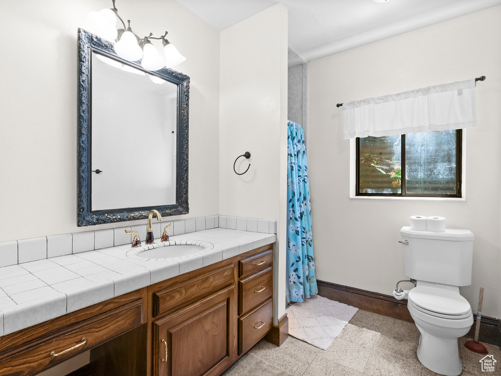 Full bath featuring vanity and a shower with curtain