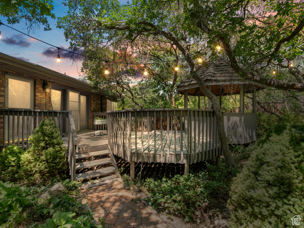 View of yard featuring a gazebo and a deck