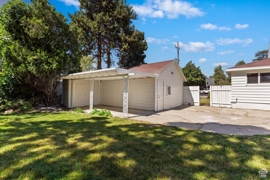 Garage featuring a carport