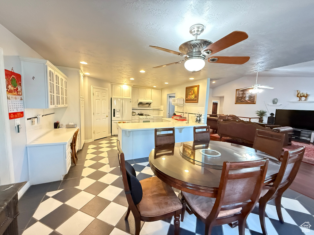 Dining room featuring tile patterned floors, a ceiling fan, and recessed lighting