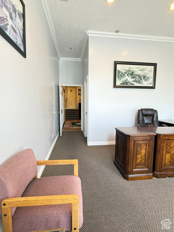 Office area with dark colored carpet, crown molding, and recessed lighting