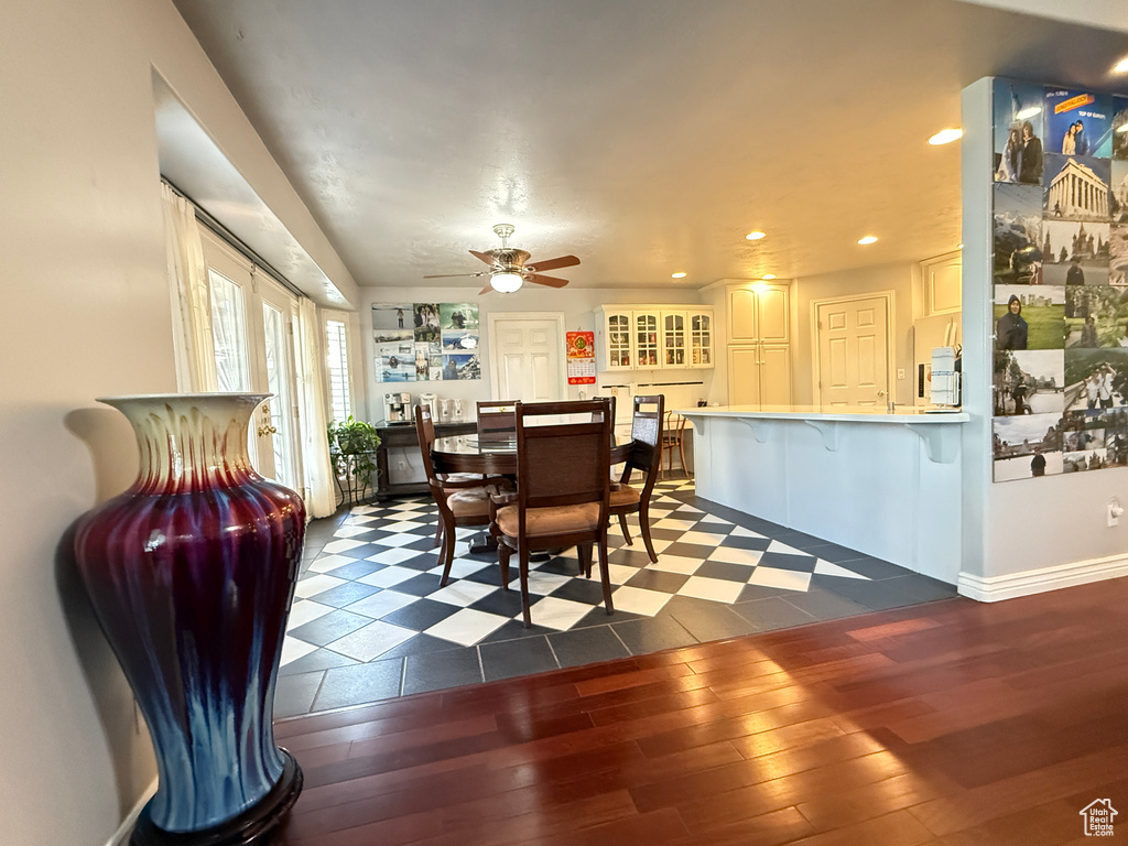 Dining room featuring ceiling fan, wood-type flooring, and recessed lighting