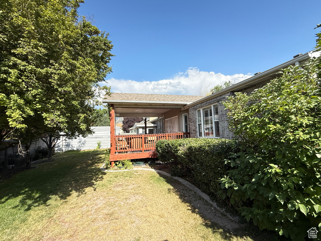View of yard featuring a deck