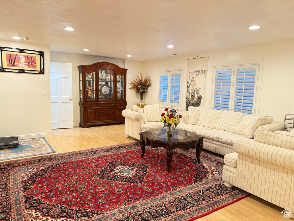 Living room with wood finished floors and recessed lighting