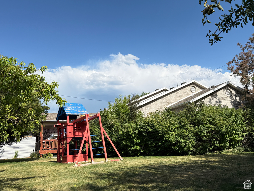 View of green lawn with a playground