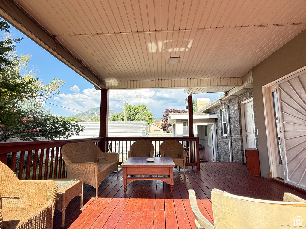 Wooden deck featuring outdoor lounge area