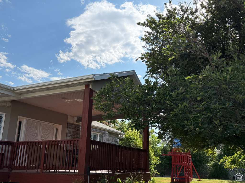 View of property exterior featuring a playground