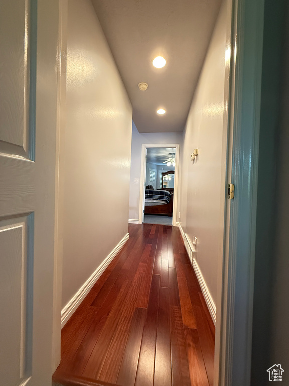 Hallway featuring dark wood finished floors and recessed lighting