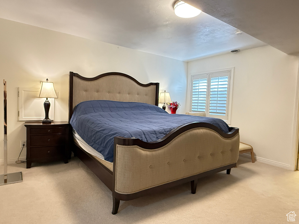 Bedroom with light carpet