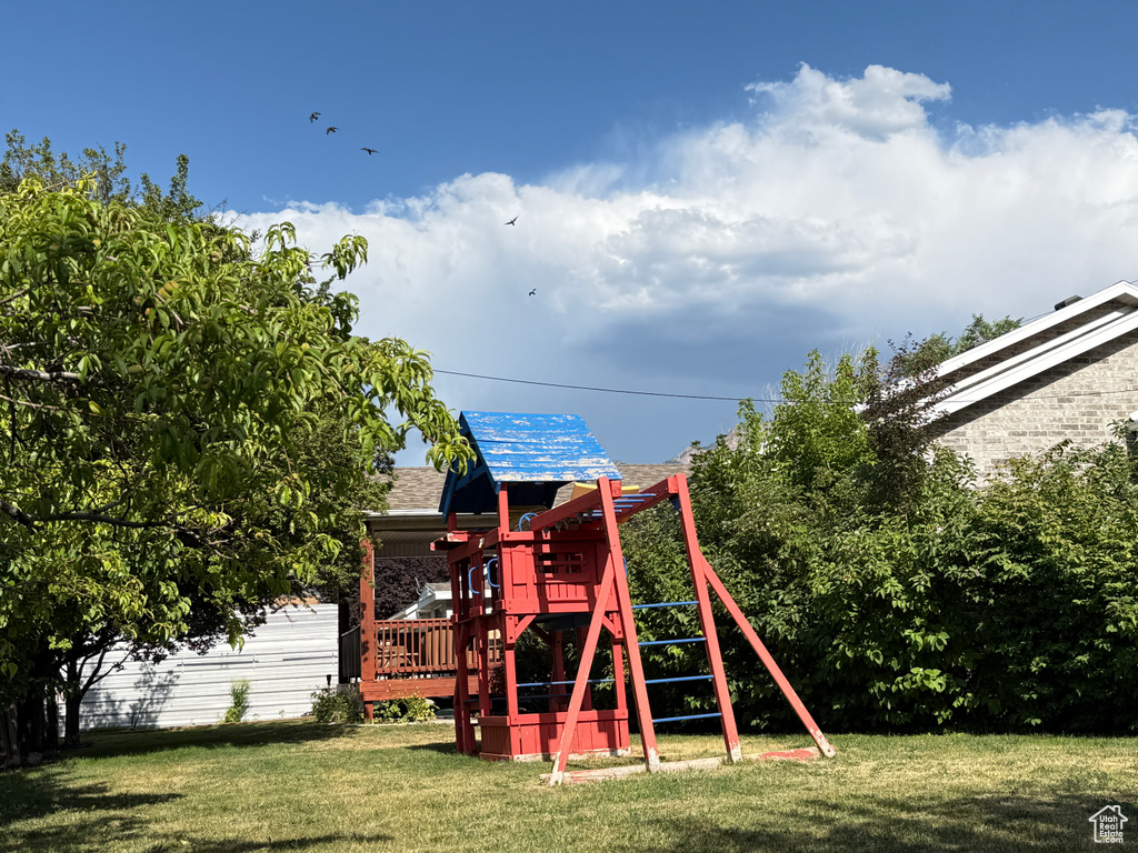 View of jungle gym with a yard