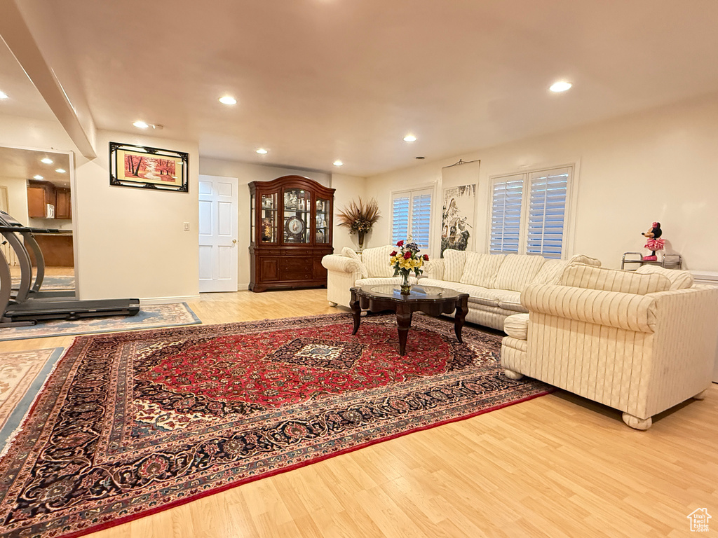 Living room with wood finished floors and recessed lighting