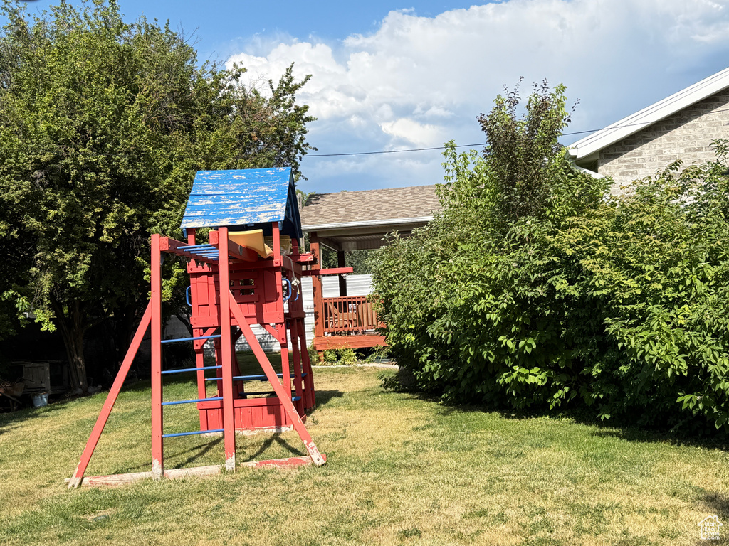 View of jungle gym featuring a yard