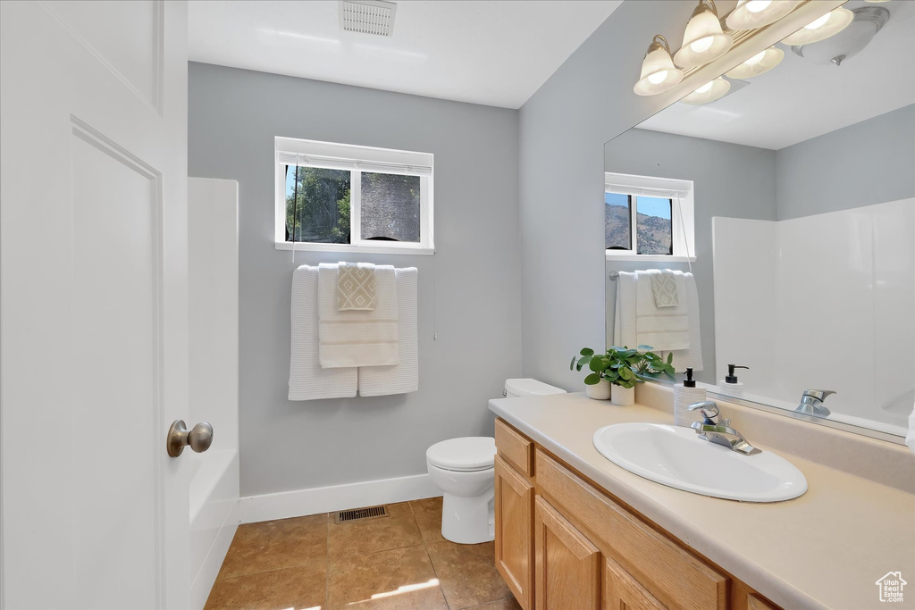 Bathroom with vanity and tile patterned floors