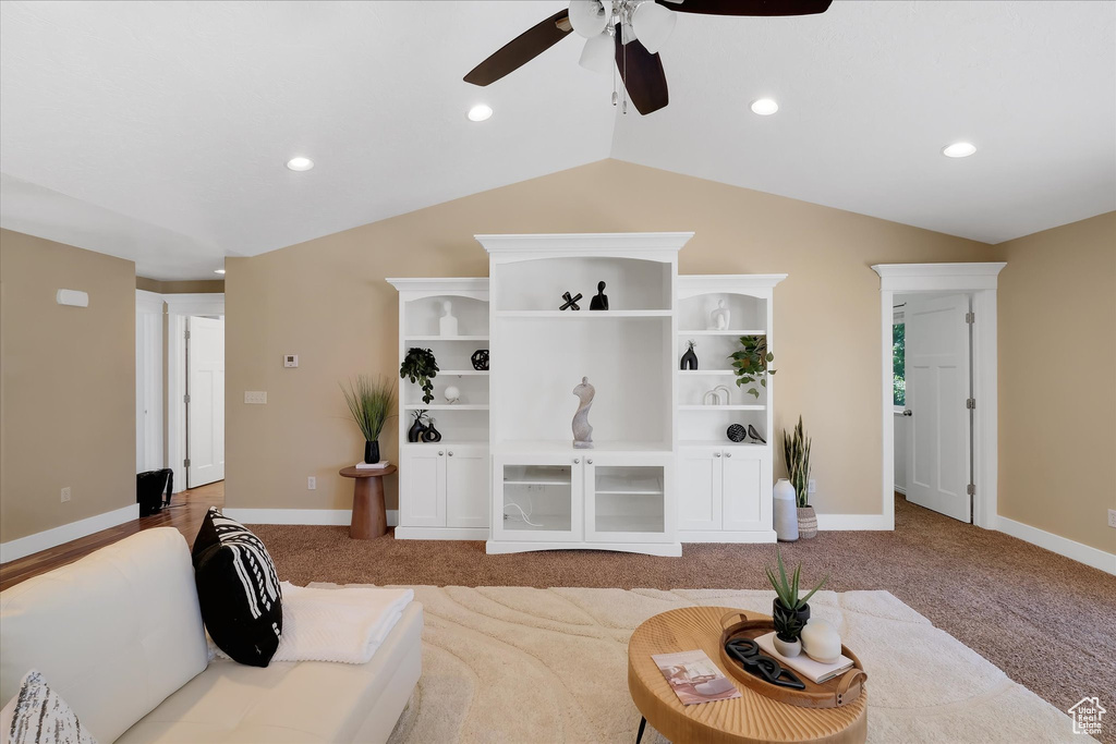 Living area featuring carpet flooring, ceiling fan, vaulted ceiling, and recessed lighting