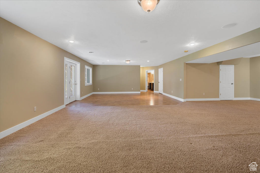 Spare room with light carpet and recessed lighting