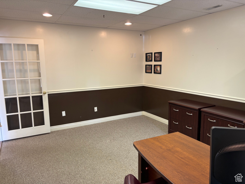 Unfurnished office with carpet floors, a drop ceiling, and recessed lighting