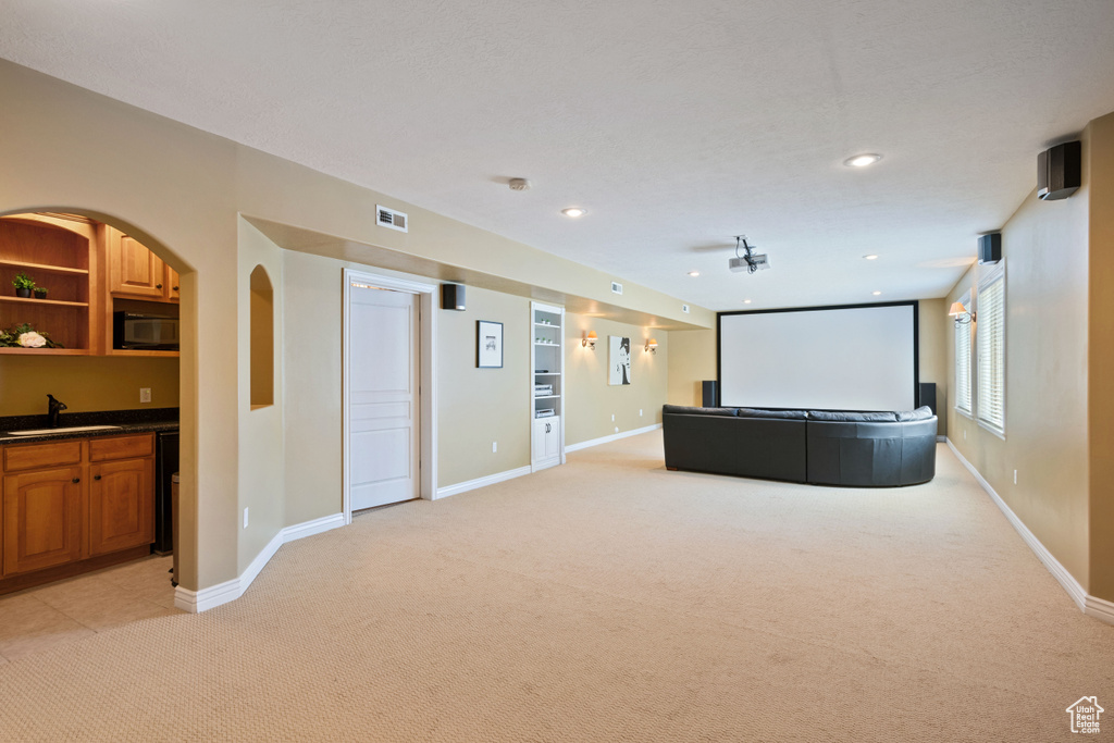 Cinema with light carpet and recessed lighting