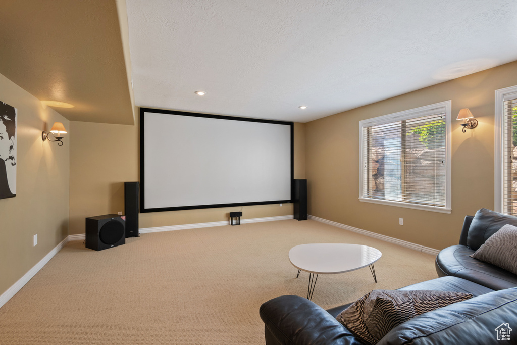 Cinema with light carpet, recessed lighting, and a textured ceiling