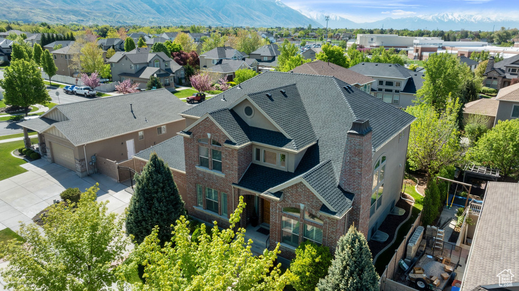 Aerial view of residential area featuring a mountain backdrop