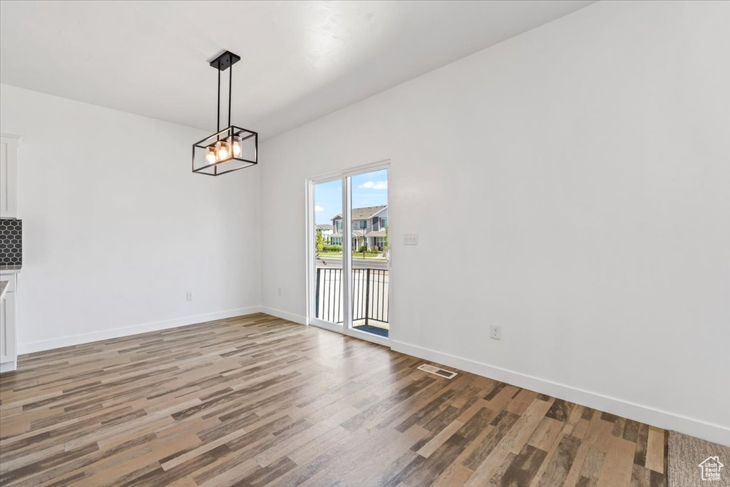 Unfurnished dining area with light wood-type flooring