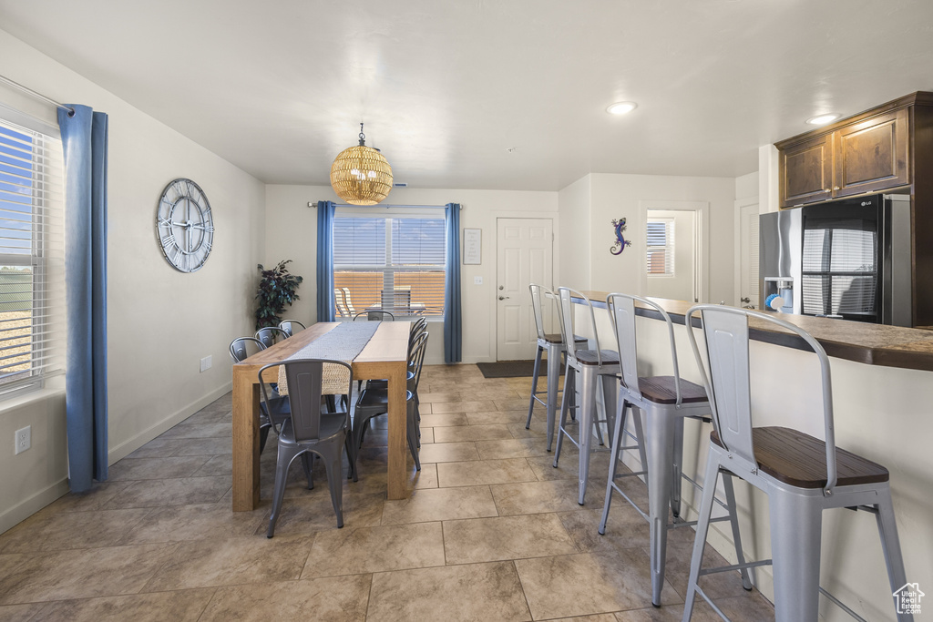 Dining room with healthy amount of natural light and recessed lighting