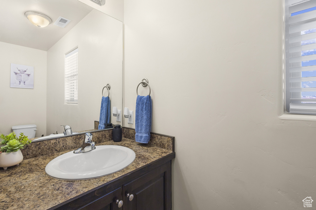 Bathroom with vanity and toilet