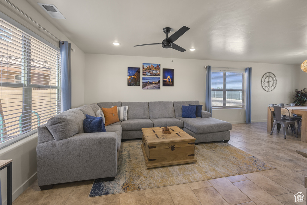 Living room featuring ceiling fan and recessed lighting
